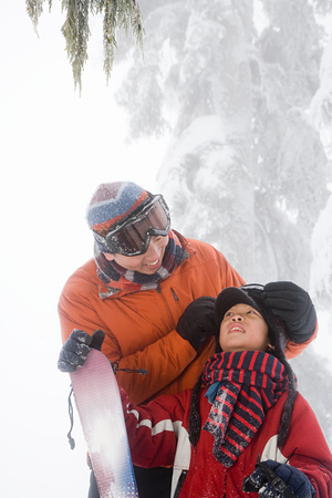 Father and son preparing for skiingの写真素材
