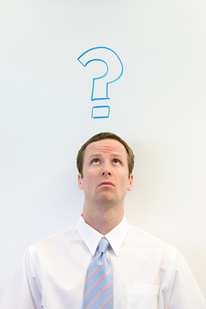 Man with question mark above his headの写真素材