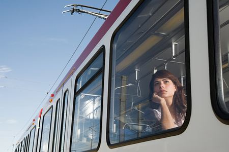 Woman on light railの写真素材