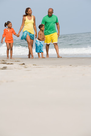 Family walking along a beachの写真素材
