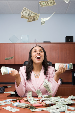 Businesswoman throwing moneyの写真素材