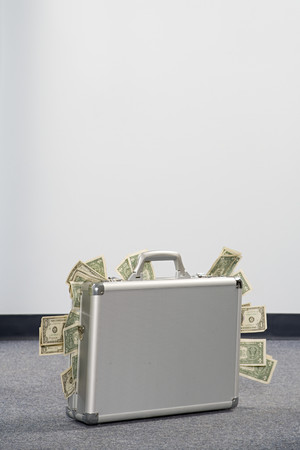 Money in a briefcaseの写真素材