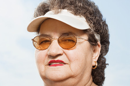 Woman wearing a sun visorの写真素材