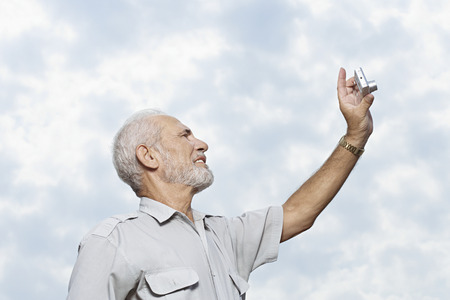 Man taking a picture of the skyの写真素材