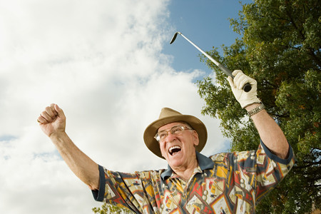 Senior man playing golfの写真素材