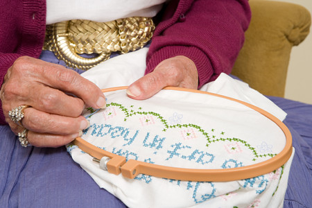 Elderly woman stitchingの写真素材