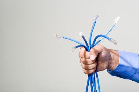 Man holding network cablesの写真素材