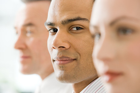 Three faces in a rowの写真素材