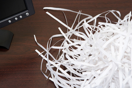 Shredded paper on a deskの写真素材