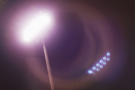 View of stadium lights at nightの写真素材