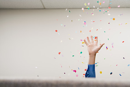 Businessman throwing confetti in the airの写真素材