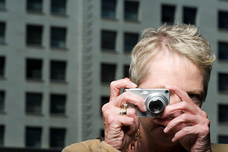 Woman taking a photographの写真素材