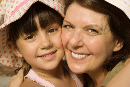 Grandmother and granddaughter hugging