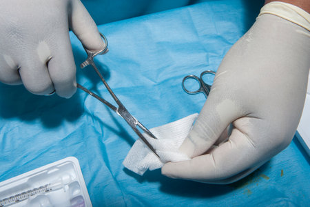 Hands with surgical toolsの写真素材