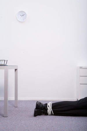 Person tied up in officeの写真素材