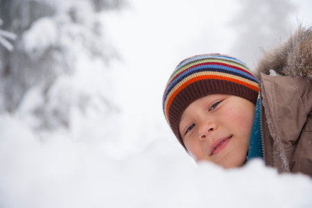 Children playing in the snowの写真素材
