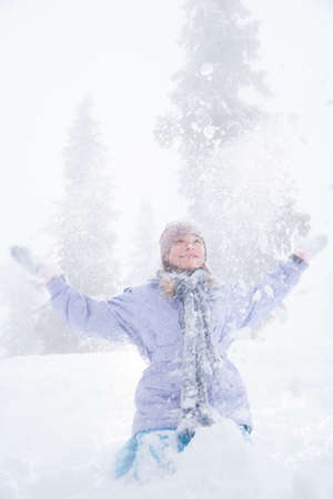 Children playing in the snowの写真素材