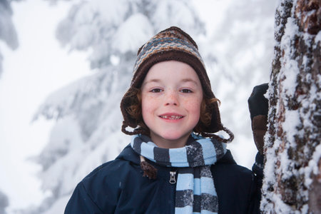 Children playing in the snowの写真素材