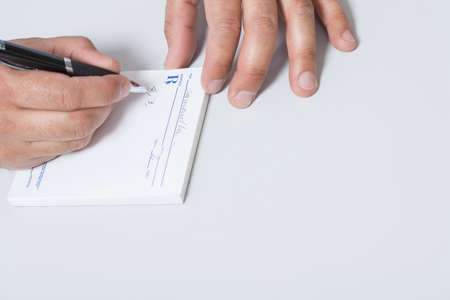 Doctor writing prescription