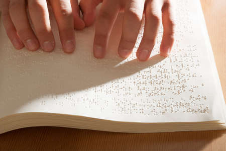 Reading braille bookの写真素材