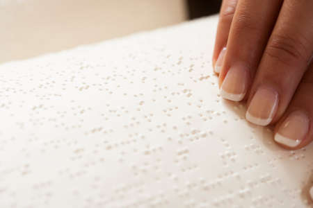 Reading braille bookの写真素材