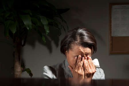 Business woman with headacheの写真素材