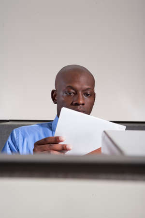 Business person in cubicleの写真素材