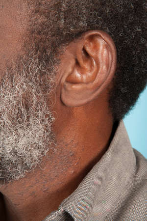 Portrait of African-American man on background