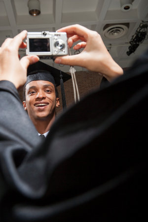 Students at graduation ceremonyの写真素材