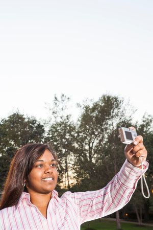 Students taking photographs on campusの写真素材
