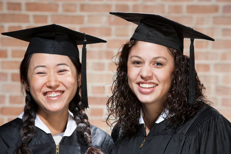 Students at graduation ceremonyの写真素材