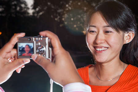 Students taking photographs on campus