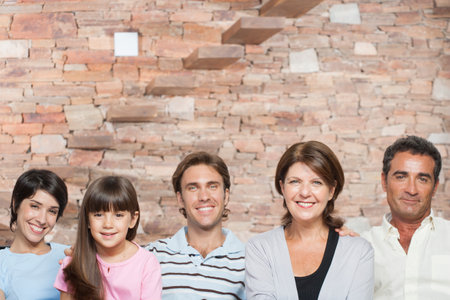 Hispanic family sitting in living roomの写真素材
