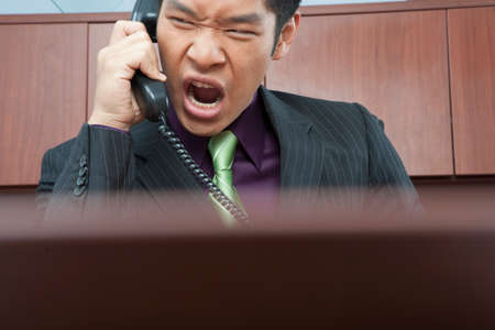 Angry businessman on phone