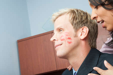 Woman seducing man in officeの写真素材