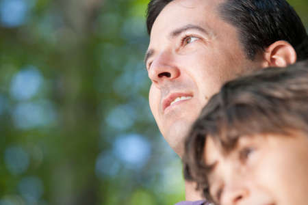 Portrait of father and son together in natureの写真素材