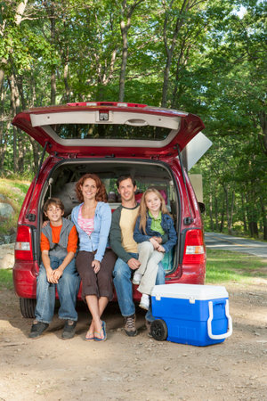 Family packing car on camping tripの写真素材