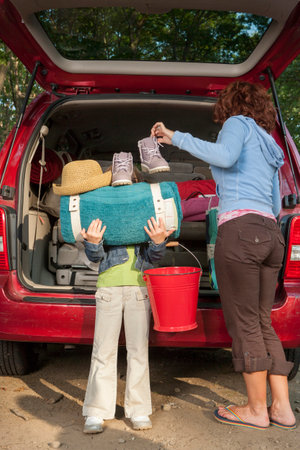 Family packing car on camping tripの写真素材