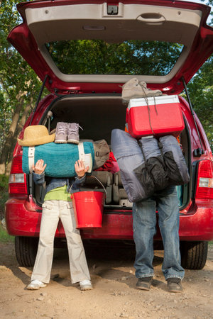 Family packing car on camping tripの写真素材