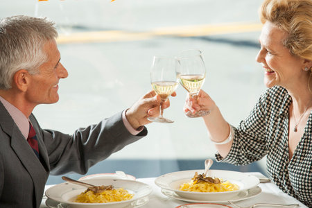 Couple eating meal together at restaurantの写真素材