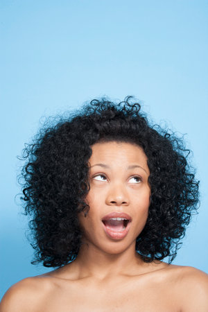 Portrait of young woman in studioの写真素材