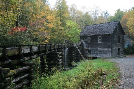 An old mill with a water trough bringing water to itの写真素材
