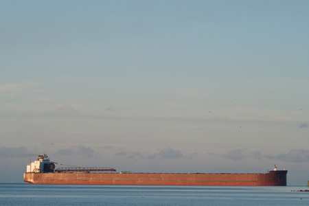 A great lakes freighter approaching a port (lots of copy space)のeditorial素材