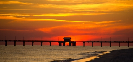 A view of a Gulf Coast fishing pier at sundownの写真素材