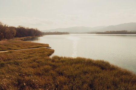 Sunset over Lake Banyoles. Moments of relaxation in winter.の写真素材