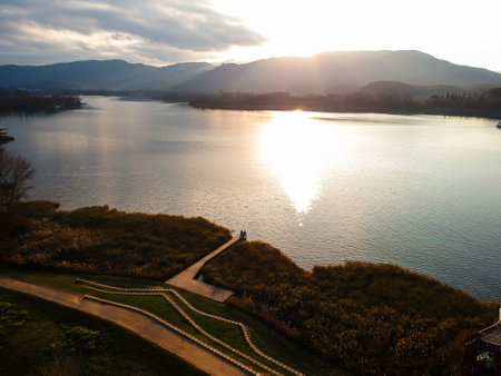 Sunset over Lake Banyoles. Moments of relaxation in winter.の写真素材