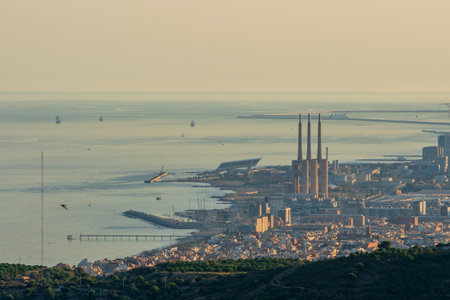Panoramic view of the entire city of Barcelona and its surroundings. During sunset one day in late summer. We can see the Mediterranean sea completely flat.の写真素材