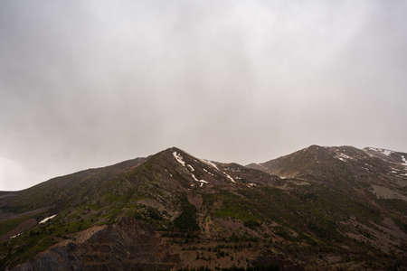 Panta de Sallente, in the Vall Fosca in the Pyrenees. On a day of early spring, cloudy and rainy. The swamp is quite empty, waiting to be filled with the melting of the mountains next door.の写真素材