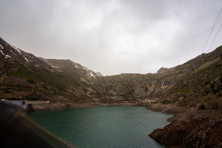 Panta de Sallente, in the Vall Fosca in the Pyrenees. On a day of early spring, cloudy and rainy. The swamp is quite empty, waiting to be filled with the melting of the mountains next door.の写真素材