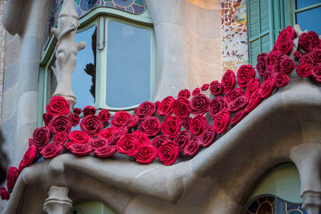 BARCELONA, SPAIN, APRIL 23, 2021: Casa Batllo in Barcelona, one of the most beautiful houses on Passeig de Gracia. By the architect Antoni Gaudi. Decorated with roses for St. Georges Day.のeditorial素材